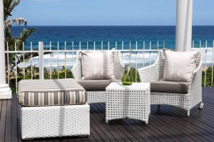 All weather outdoor Elita arm chair and ottomans.
