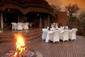 Luxury safari dinner with makuti arm chairs.