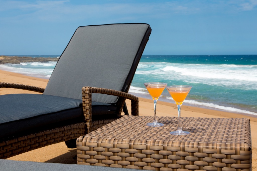 All weather outdoor loungers with wheels and adjustable back plus ottoman.