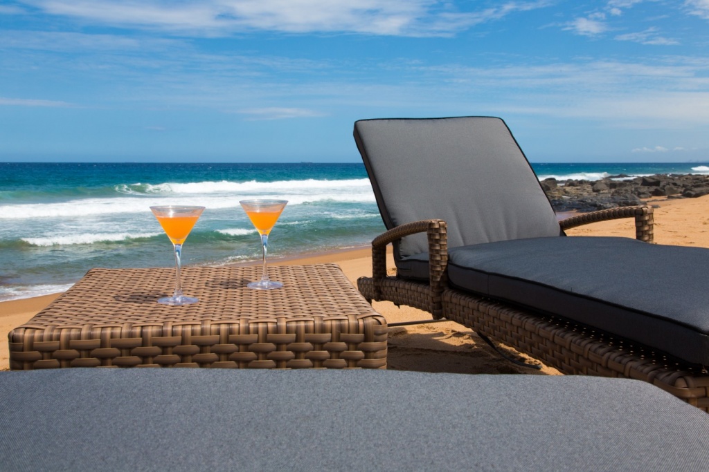 All weather outdoor loungers with wheels and adjustable back plus ottoman.