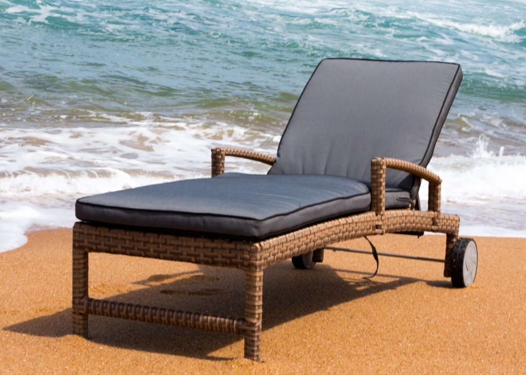 All weather outdoor lounger with wheels and adjustable back plus ottoman.