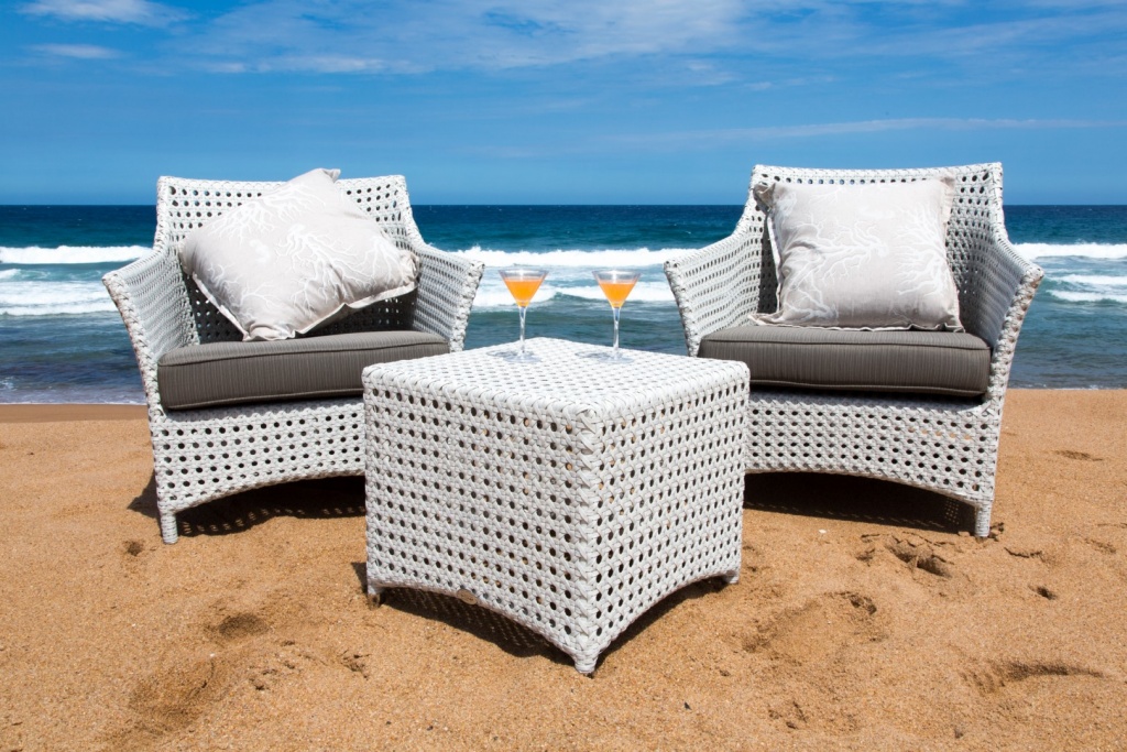 All weather outdoor Elita armchair and ottomans.