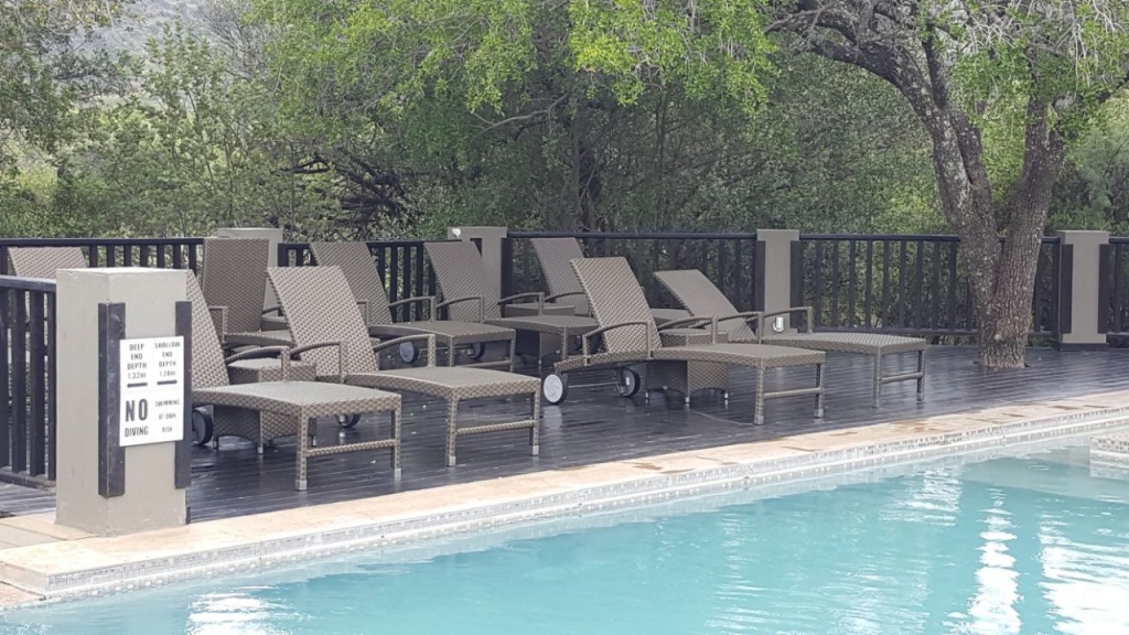 All weather outdoor loungers with wheels and adjustable back plus ottoman.